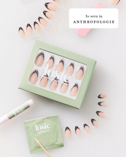 A flat-lay of a box of Loste press-on nails,