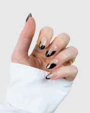 Hand wearing Loste press-on nails