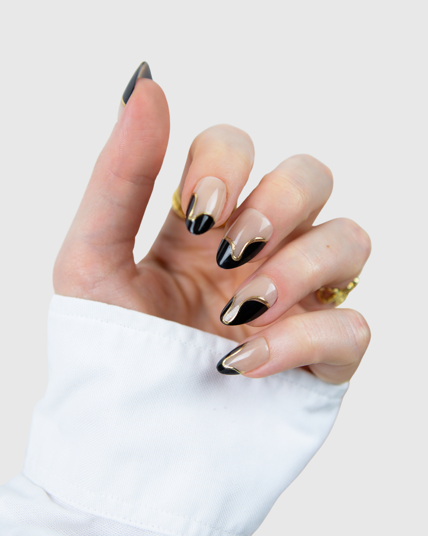 Hand wearing Loste press-on nails
